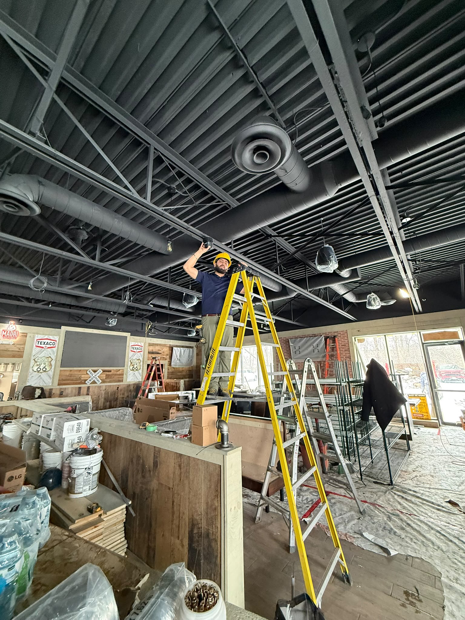 Commercial restaurant security camera installation on ceiling